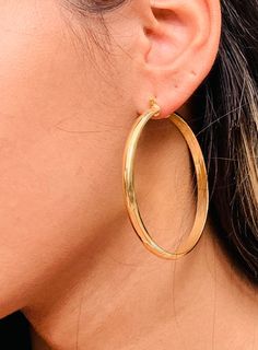 18kt Gold Filled Large Hoop Earrings Non Tarnish - Hypoallergenic Hoop Size:5x64mm Width: 6mm Material: 18 Karat Gold Filled, Hypoallergenic. Tarnish Resistant. Gold-filled does not de-laminate or peel like Gold plated Jewelry nor does it tarnish as readily as silver. Generally speaking, gold filled is better quality and will have a much longer lasting color than plated jewelry. We recommend keeping abrasive chemicals away from the jewelry for the items to last. Thank you for visiting and suppor Simple Gold Hoop Earrings, Simple Hoop Earrings, Gold Filled Hoops, Knot Earrings, Gold Filled Earrings, Alessandra Ambrosio, Large Hoop Earrings, Vanessa Hudgens, Jessica Alba