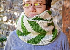 a man wearing glasses and a knitted green and white cowgirl neckwarf