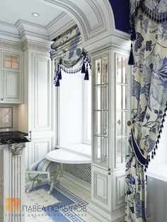 an ornate bathroom with blue and white decor