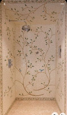 the shower is decorated with flowers and leaves