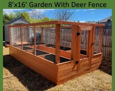 a large wooden garden bed with chicken cages in it and the words 8x16's garden with deer fence