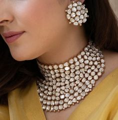 This Uncut Polki Diamond choker set comes with gold plated finish and a beautiful sabyasachi inspired look. The set can be paired as desired and can be worn separately as well. The perfect jewelry for reception, weddings, sangeet, pithi/haldi, engagements or a fun night out for a statement look! Product Details: * Choker * Stud Earrings This is the actual product picture so no surprises (please note colors may vary slightly due to image resolution etc)   NOTE - Please Reach out to me for availability and shipping times. This set is available for preorder. If the set is available to ship I will ship, but if not then it will take 2-3 weeks for shipping. Please check availability BEFORE placing order.  To see more beautiful and unique pieces, please check out my shop: https://www.etsy.com/sho Sabyasachi Bride Jewellery, Yellow Gold Chandbali Jewelry With 17 Jewels, Gold Kundan Necklace With Cutdana For Reception, Gold Plated Kundan Necklace For Reception, Gold Cutdana Jewelry Sets For Reception, Gold-plated Kundan Necklace For Reception And Festivals, Gold Temple Necklace With Cutdana For Receptions, Gold Jewelry For Reception And Diwali, Gold Kundan Necklace With Jewels