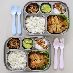 two trays filled with different types of food and utensils next to each other