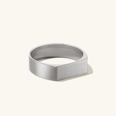 The signet ring you know and love—now with some more substance. Because the bold agenda applies to your jewelry, too. Modern Wide Band Sterling Silver Signet Ring, Modern Square Cut Signet Ring With Polished Finish, Modern White Gold Rectangular Signet Ring, Modern Square Cut Signet Ring As Gift, Modern Rectangular Signet Ring For Promise, Modern Rectangular Signet Promise Ring, Modern Silver Rectangular Signet Ring, Modern Engraved Ring With Thick Band For Everyday, Minimalist White Gold Rectangular Signet Ring