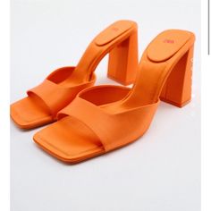 Satin Sandals With Mule Style Block Heels. Squared Toe. Airfit. Technical Flexible Latex Foam Insole Designed To Offer Increased Comfort. Heel Height: 3.5 Inches (9 Cm) Orange Summer Heels, Orange Formal Heels For Summer, Elegant Orange Summer Heels, Elegant Orange Heels For Summer, Orange Sculpted Heel Heels For Summer, Orange Heels With Sculpted Heel For Spring, Elegant Orange Sandals For Summer, Elegant Orange Sandals With Padded Heel, Chic Orange Open Heel Heels