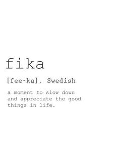 the words fika are written in black and white on a white background with an orange flower