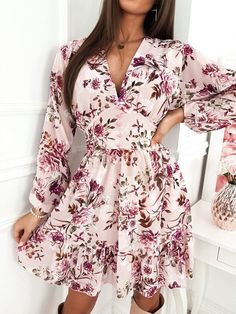 Featuring a lovely floral pattern with button-up design, this dress is fabulous chic. Pair with your favorite heels or booties. Made with a polyester blend. Chic Floral Print Dress For Date Night, Elegant Long Sleeve Floral Dress With Ditsy Print, Pink Floral Print Mini Length Dress, Chic V-neck Floral Dress For Fall, Pink Mini Length Floral Dress, Pink Mini Floral Print Dress, Feminine Midi-length Floral Dress With Rose Print, Feminine Floral Dress For Party, Elegant Spring Floral Dress With Rose Print