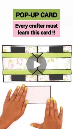 two hands holding up a card that says pop - up card every crafter must learn this card