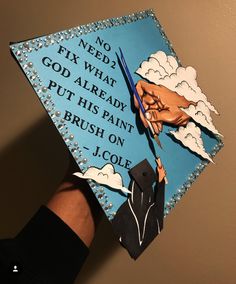 a graduation cap with the words no need to fix what god already put his paint brush on j cole