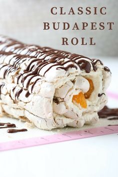 a close up of a piece of food on a table with words above it that reads classic budapest roll