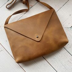 Genuine Leather Handbag  This sophisticated minimal design made of distressed genuine leather is the perfect hand bag to take you from day to night!  ~ Bag Dimensions: 16cm x 21cm Womens Handbag, Brown Shoulder Bag, Genuine Leather Handbag, Cow Hide, Sterling Silver Necklace Pendants, Silver Pendant Necklace, Minimal Design, Hand Bag, Leather Handbag