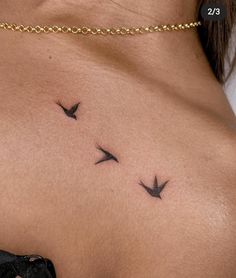 a woman's back with three birds on it