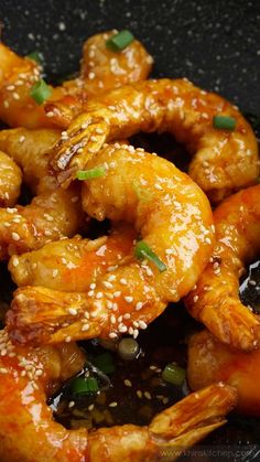 crispy honey shrimp with sesame seeds in a skillet