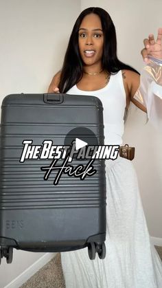 a woman holding a piece of luggage with the words best maching tricks on it