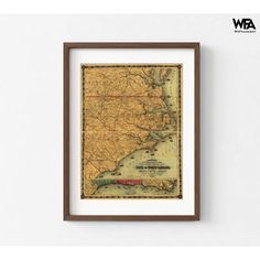 an old map of the state of new york in brown frame on a white wall