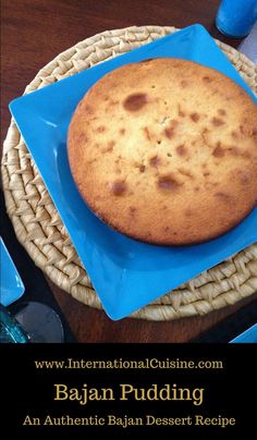 a close up of a plate of food on a table with a blue napkin and utensils