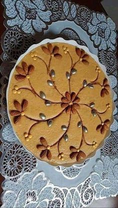 a cake is sitting on top of a doily