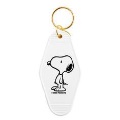 a keychain with a cartoon character on it's face and the words charlie peanuts