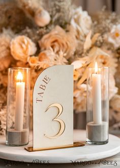 the table is set with candles and a sign that says i do me 3 on it