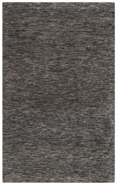 an area rug with dark gray and light brown colors