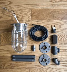 an assortment of electrical equipment laid out on a wooden floor