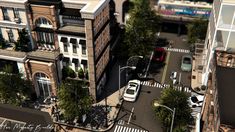 an aerial view of a city street with parked cars