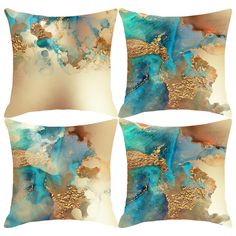 four decorative pillows with blue and gold designs