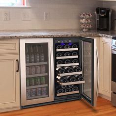 a wine cooler in the corner of a kitchen