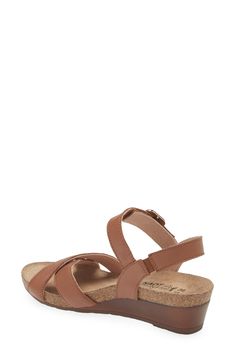 A gleaming buckle stands out against the supple leather straps on this open-toe sandal set on a low wedge for comfortable height. 1 3/4" heel (size 39) Adjustable ankle strap with buckle closure Cushioned footbed with arch support Leather upper and lining/synthetic sole Medium Width Low Heel Wedge Sandals With Buckle, Brown Slingback Sandals With Buckle Closure, Brown Footbed Sandals With Removable Insole, Brown Low Heel Slingback Sandals With Buckle, Adjustable Brown Wedge Heel Sandals, Leather Toe Loop Wedge Sandals, Leather Low Heel Wedge Sandals With Buckle Closure, Brown Wedge Sandals With Adjustable Strap, Low Heel Leather Wedge Sandals With Buckle