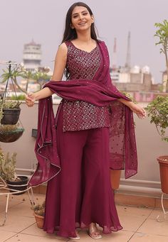 Readymade Faux Georgette Pakistani Suit in Wine. This attire with Cotton Lining is Enhanced with Resham and Sequins Work. Available with a Faux Georgette Palazzo and Faux Georgette Gota Lace Dupatta in Wine.The Kameez and Bottom Length are 32 and 40 Inches Respectively. We sell all kinds of salwar kameez sets for women Georgette Salwar Kameez | Crepe Salwar Kameez | Art Silk Salwar Kameez | Velvet Salwar Kameez | Chiffon Salwar Kameez | Net Salwar Kameez | Zari Work Salwar Suits | Indian Festiva Fitted Purple Embroidered Palazzo Set, Traditional Purple Sequined Sets, Fitted Purple Embroidered Sets, Elegant Purple Chinon Sets, Festive Purple Sequined Sets, Festive Purple Sequin Sets, Embroidered Fitted Georgette Pant Set, Fitted Embroidered Georgette Pant Set, Fitted Sets With Mirror Work On Chinon