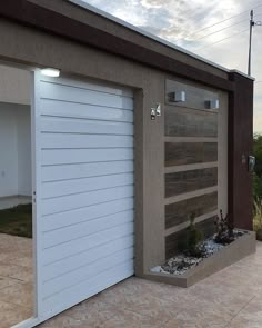 an open garage door on the side of a house