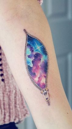 a woman's arm with a colorful tattoo on it