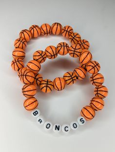 Available in multiple sizes to fit your needs! Makes an excellent gift for teams or individuals! Great for basketball mom's too! Use the personalization box below to add a word to your bracelet! Perfect for a personalized gift, or a group gift with your team name! Enjoy free shipping on this order when you spend $35+! Free gift wrapping available upon request! Just mark item as a gift when purchasing! Bulk orders welcome! Qualifying orders receive bulk discount of 15% off! Simply message me for School Spirit Jewelry With Letter Beads For Gifts, Customizable Adjustable Sports Bracelet, Personalized Team Spirit Beaded Bracelets For Gift, Customizable Sports Team Color Jewelry For Events, Personalized Team Spirit Wristband For Sports Events, Customizable Adjustable Wristband For Sports Events, Personalized Team Spirit Wristband For Sports, Personalized Sporty Wristband For Sports Events, Sporty Personalized Bracelets For Sports Events