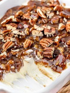 a dessert with pecans and caramel on top