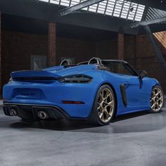 a blue sports car parked in a garage