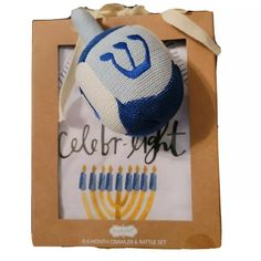 a blue and white hanukkah ornament in a cardboard box