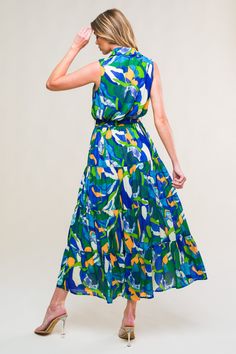 A printed woven midi dress featuring shirt collar, sleeveless, button down, elasticized waist, self sash tie and tiered skirt Details: Self : 100% PolyesterLining : 100% Polyester Size & Fit - Model is 5`8" And Wearing Size Small- Measurements Taken From Size Small- Approx. Length: 53" Flowy Green Maxi Dress With Tie Waist, Green Midi Dress With Elastic Waistband For Summer, Spring Dress With Tie Waist And Flowy Skirt, Chic Tie Waist Tiered Skirt Dress, Chic Tie Waist Dress With Tiered Skirt, Chic Tiered Skirt Dress With Tie Waist, Sleeveless Midi Dress With Elastic Waistband For Summer, Chic Dresses With Tie Waist And Tiered Skirt, Summer Green Belted Midi Dress