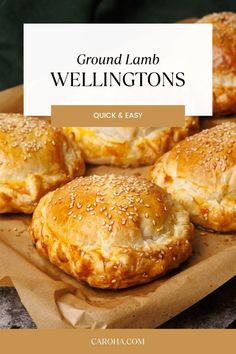 some baked goods are sitting on a brown paper plate with the words ground lamb wellingtons