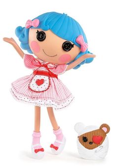 a doll with blue hair wearing a pink dress and white shoes next to a teddy bear