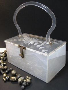 "Beautiful Mid century Merle Norman Crystal-and-Tortoise-Look Evening Purse. Lucite Purse( as described in the booklet) It has 2 top Handles. Comes with its Original Box and Booklet. ca 1960s. Measures 9\"L. x 4-1/4\"H to the lid. and the handles drop it is 4\". This case has never been used and it is in Pristine Condition. The Cardboard Box it is in very good condition. Much better in Person." Thrifted Clothes, Evening Purse, Florida Usa, Vintage Lover, T Shirt And Jeans