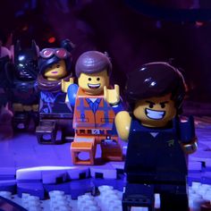 the lego batman movie characters are posed in front of a purple background with black and blue lights