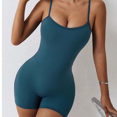 Cami Activewear Bodysuit In Color Sea Blue Spaghetti Strap Thick Material Stretchy Blue Spaghetti Straps Jumpsuits And Rompers, Blue Stretch Bodysuit With Spaghetti Straps, Blue Fitted Bodysuit With Spaghetti Straps, Blue Seamless Bodysuit For Loungewear, Summer Blue Bodysuit With Built-in Bra, Seamless Blue Bodysuit For Loungewear, Blue Summer Bodysuit With Built-in Bra, Blue One-piece Bodysuit With Built-in Bra, Yoga Jumpsuit