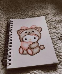 a drawing of a teddy bear holding a heart on top of a white paper sheet