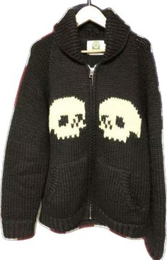 a black sweater with two skulls on it