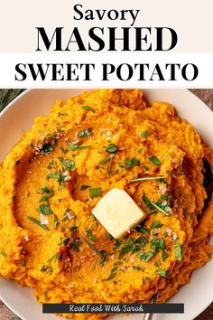 sweet potato mashed potatoes in a white bowl with butter and parsley on top