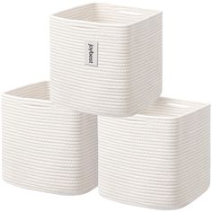 three white storage baskets stacked on top of each other in the shape of cubes