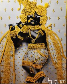 an image of a man in yellow and black with gold trimmings on his face