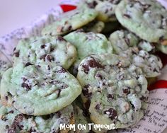 chocolate chip cookies are piled on top of each other