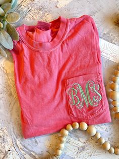 Embroidered Monogram Pocket Tee, Short Sleeve Monogram Tshirt, Comfort Colors Pocket Tee, Bridesmaid Gift, Mother's Day Gift  Please keep in mind, the embroidery closes the pocket.  Our shirts:  - Embroidered in South Carolina - Machine wash cold  - Light weight - Iron inside out for best results Pink Short Sleeve T-shirt With Machine Embroidery, Pink Crew Neck T-shirt With Pockets, Pink Monogrammed Crew Neck Top, Pink Monogram Crew Neck Top, Pink Crew Neck Top With Monogram, Pink Monogrammed Cotton Top, Pink Monogram Cotton Top, Pink Crew Neck T-shirt With Machine Embroidery, Pink Short Sleeve Top With Machine Embroidery