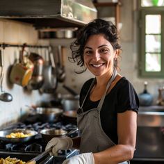 a woman in an apron is preparing food